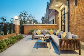 a patio with a couch and a table
