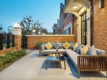 a patio with a couch and a table