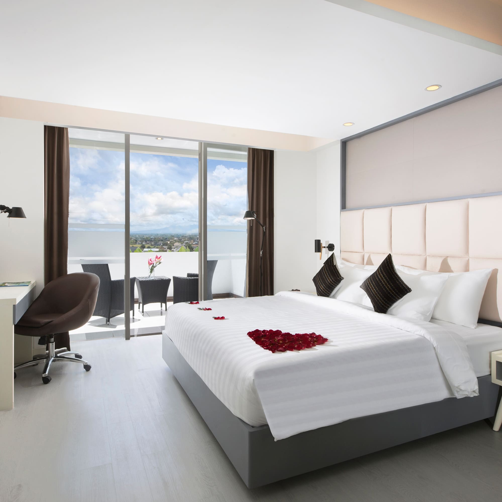 a bedroom with a bed and a desk