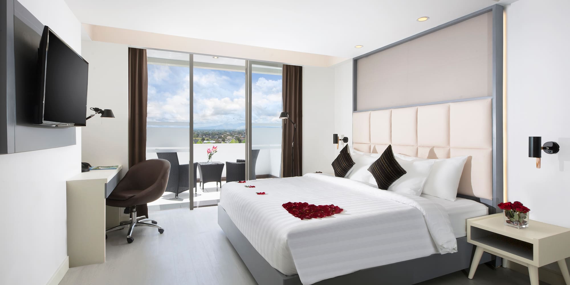 a bedroom with a bed and a desk