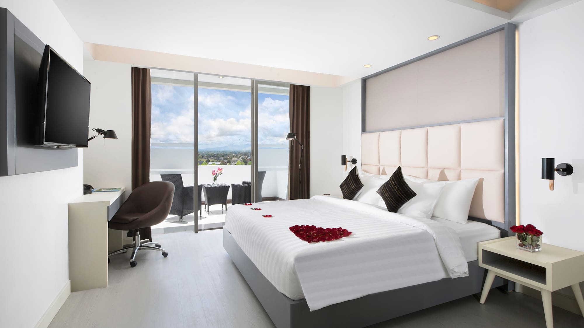 a bedroom with a bed and a desk