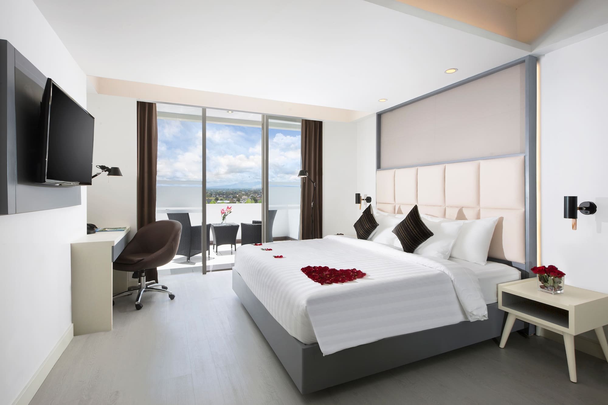 a bedroom with a bed and a desk