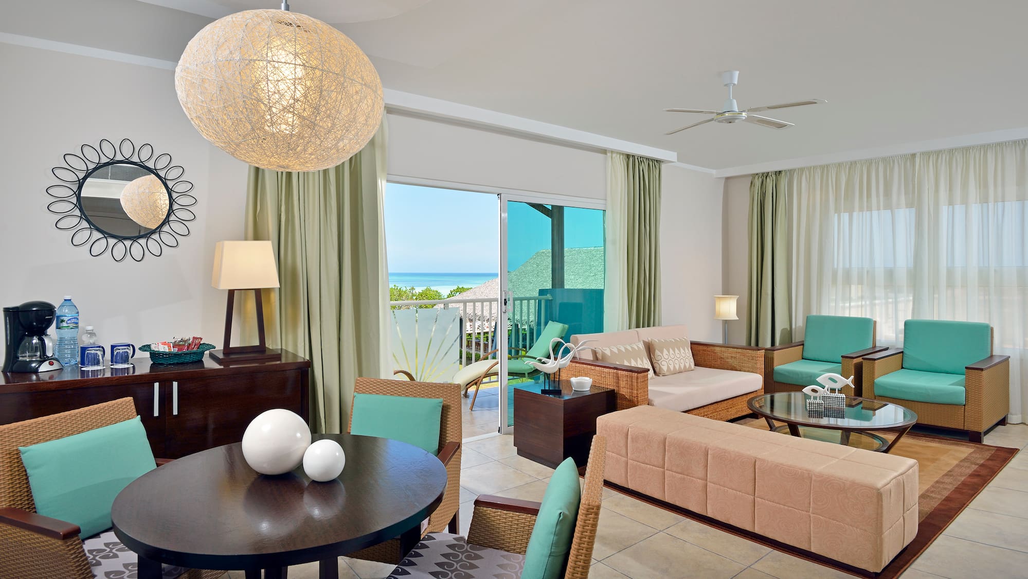 a living room with a table and chairs