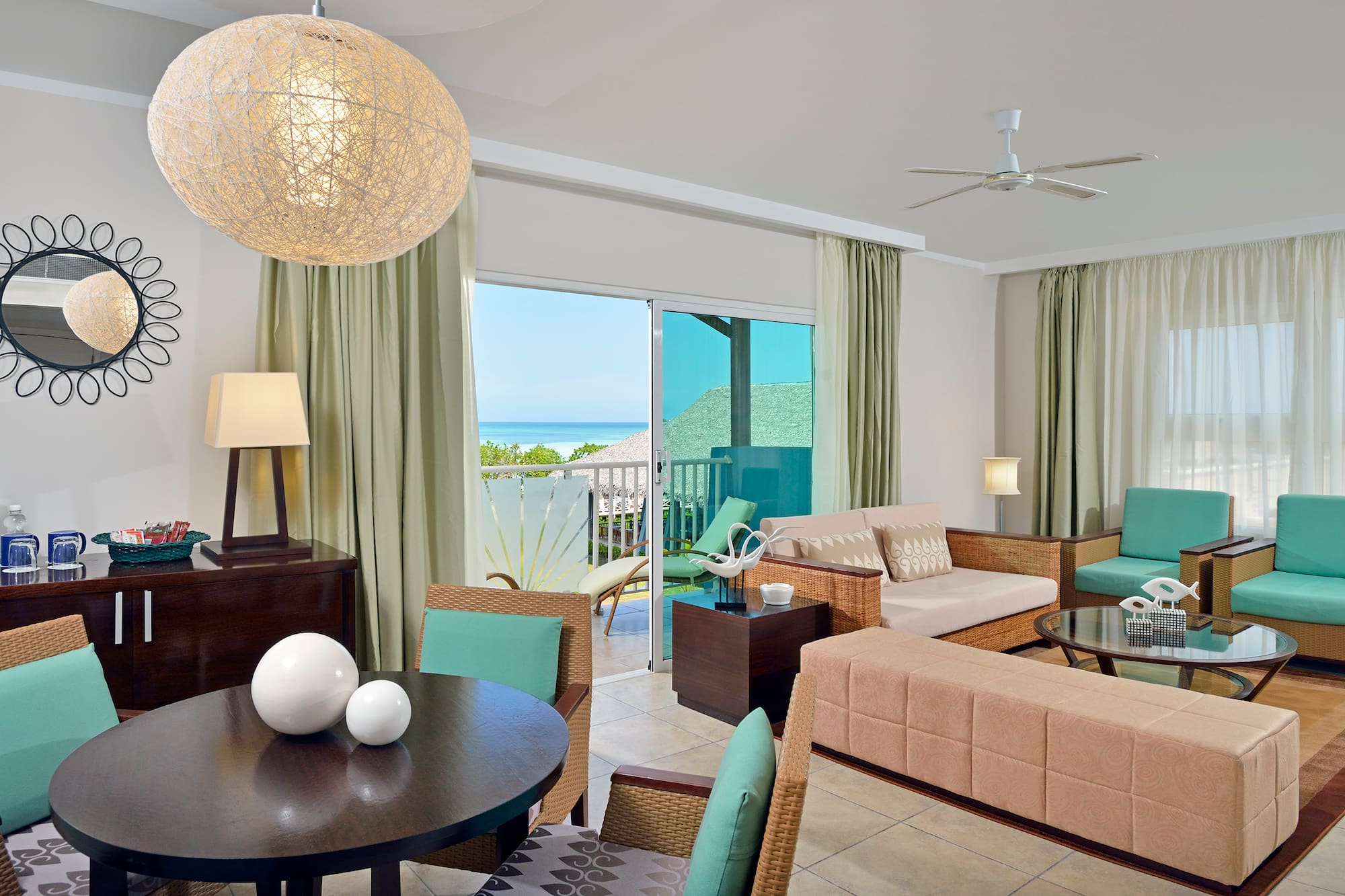 a living room with a table and chairs