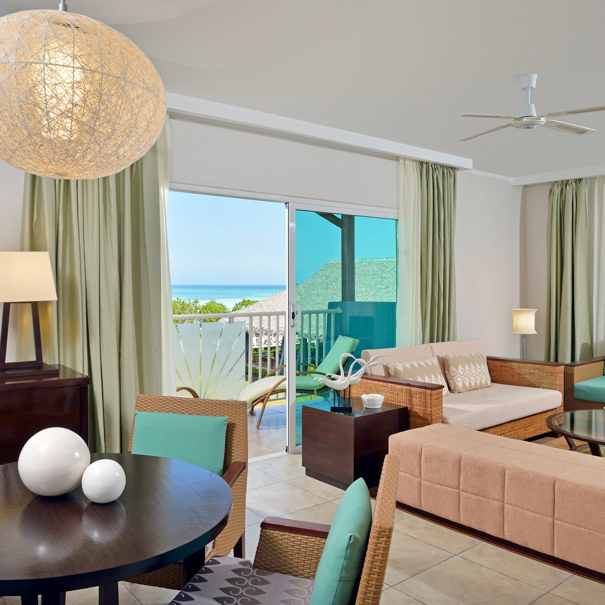 a living room with a table and chairs