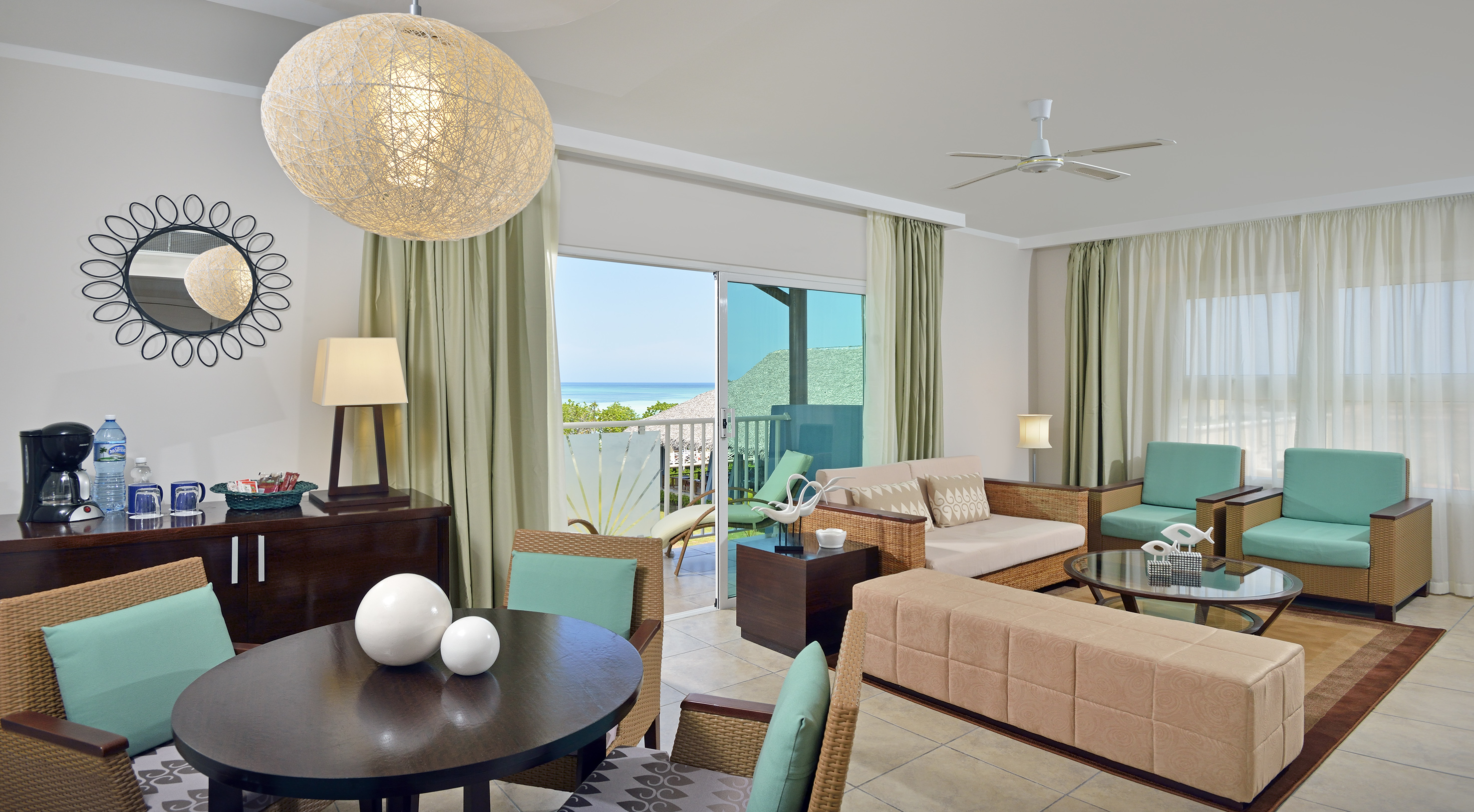 a living room with a table and chairs