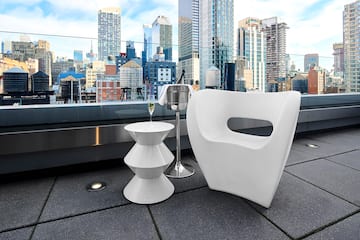 a white chair and a table on a rooftop