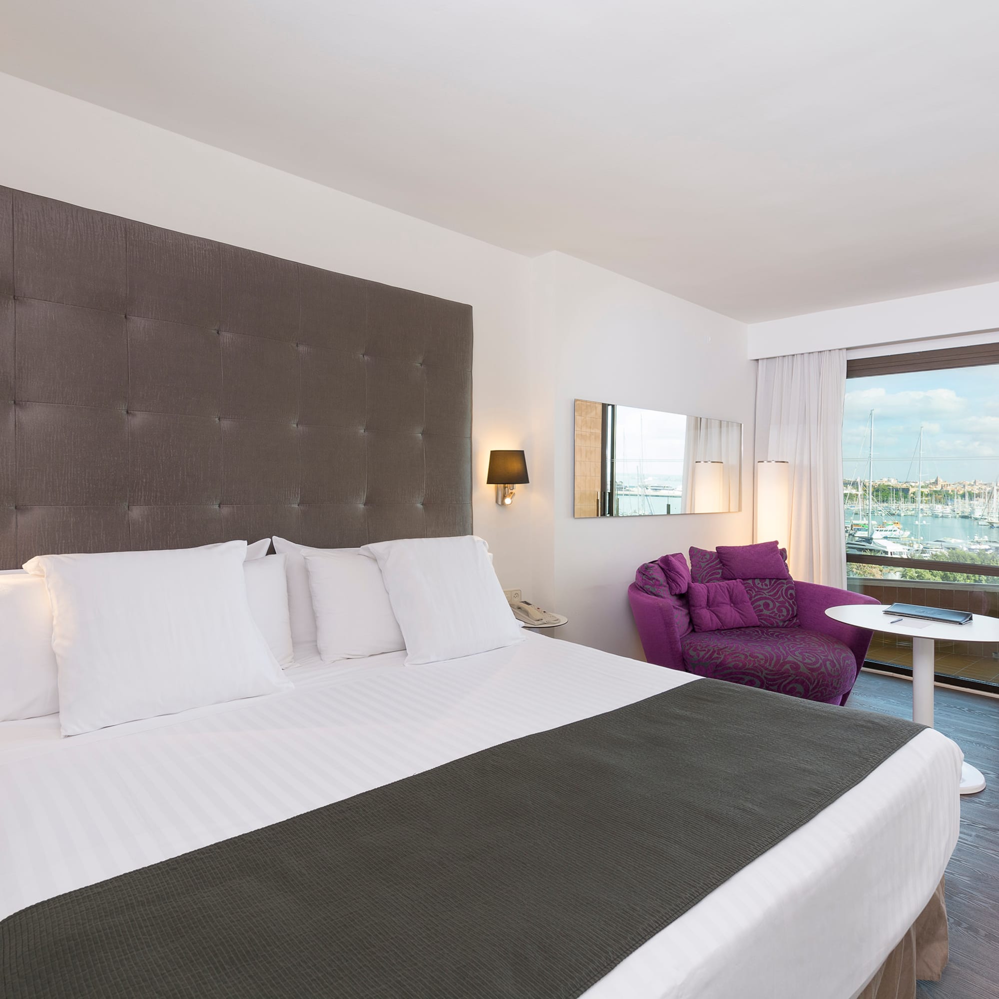 a room with a bed and a chair