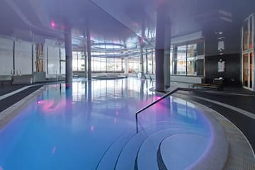 a large indoor pool with a staircase