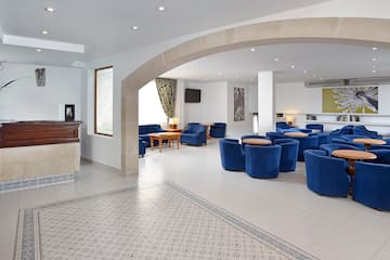 a room with blue chairs and tables