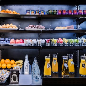 shelves with different drinks and fruits on it