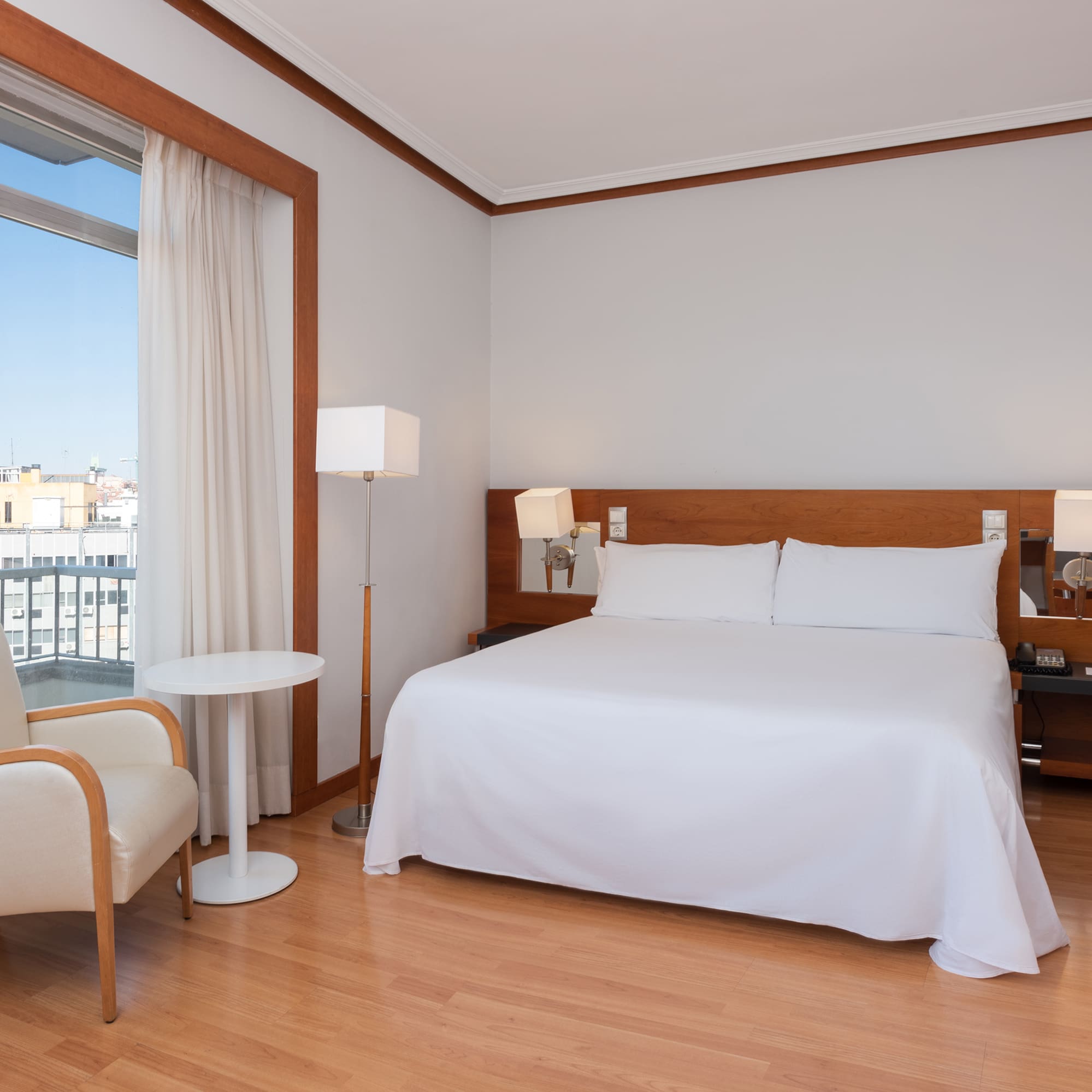 a room with a bed and a chair