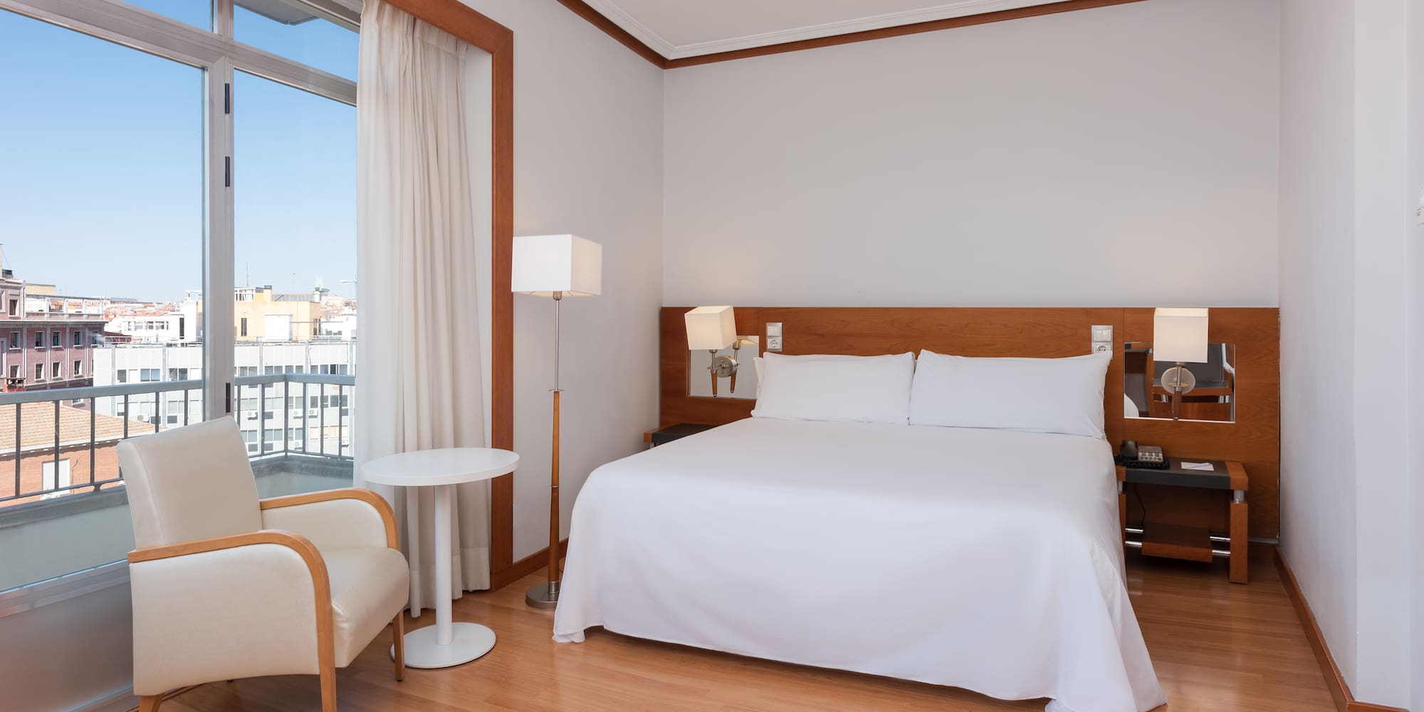 a room with a bed and a chair