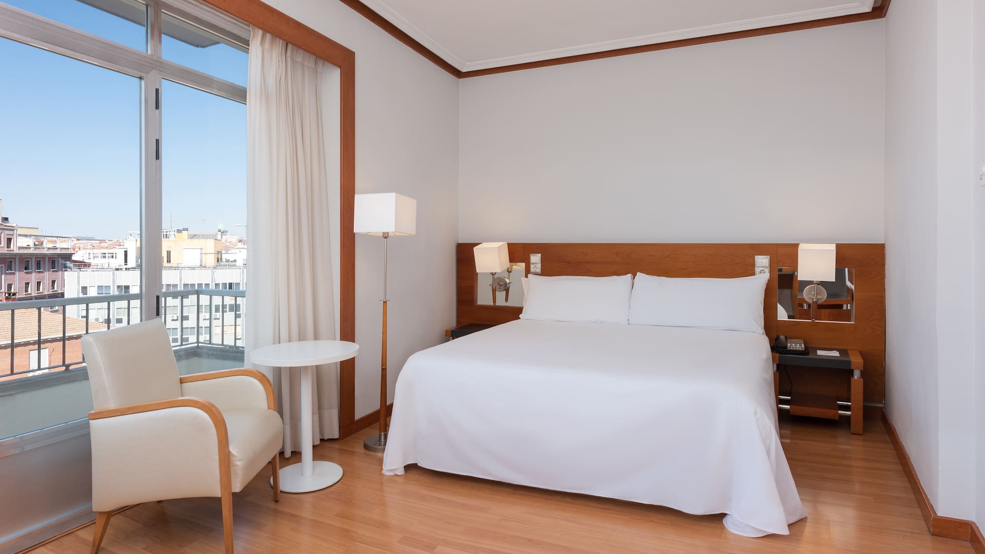 a room with a bed and a chair