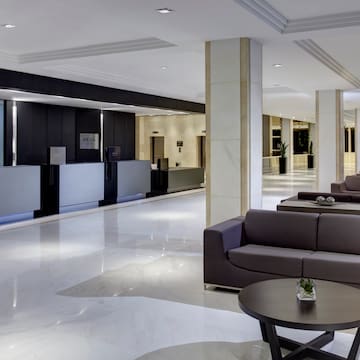 a lobby with couches and tables