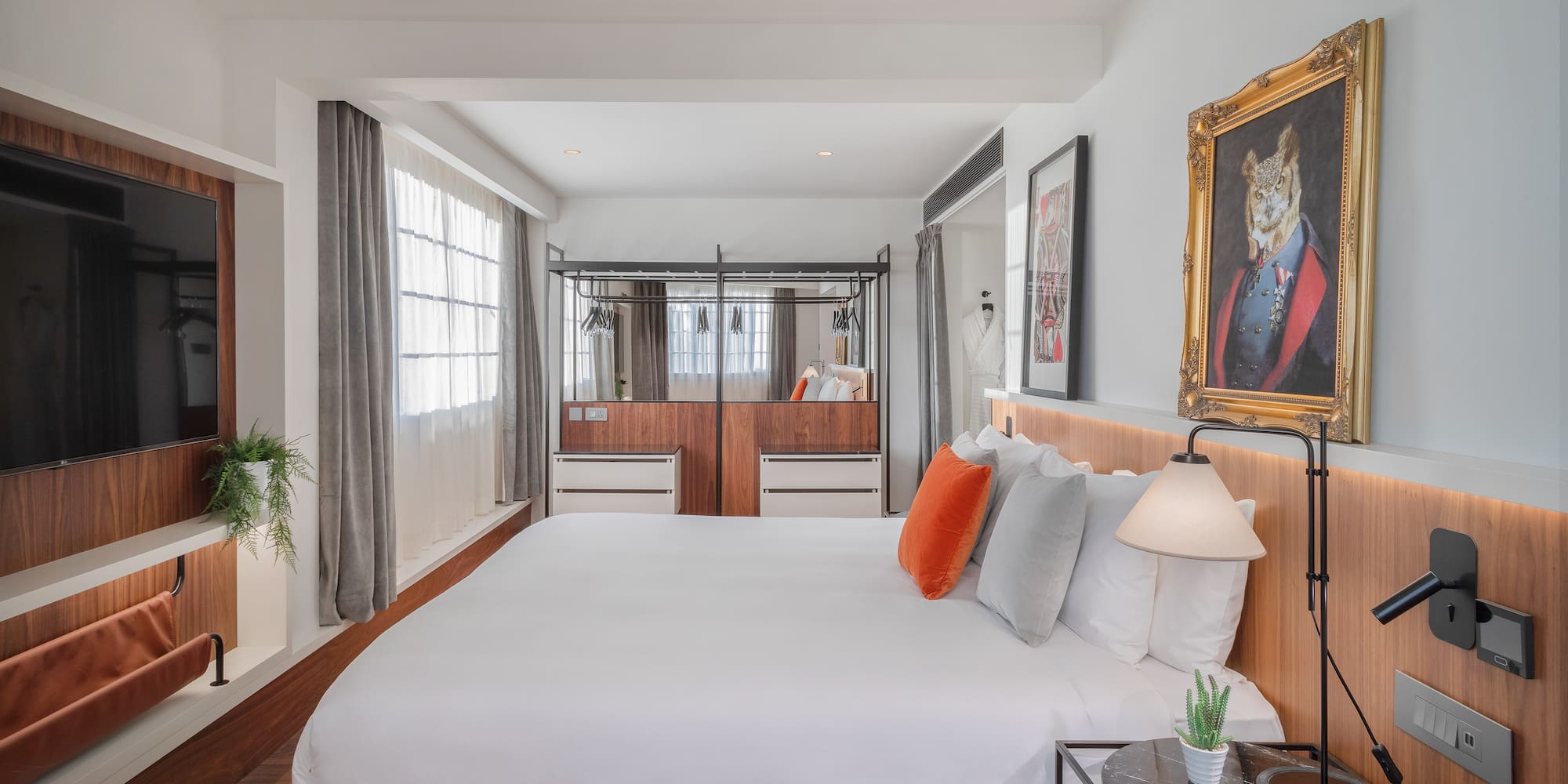 a bedroom with a bed and a mirror