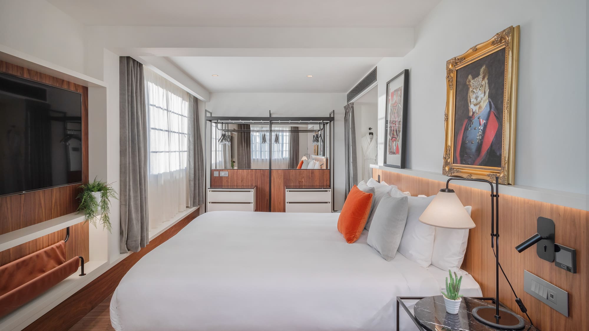 a bedroom with a bed and a mirror