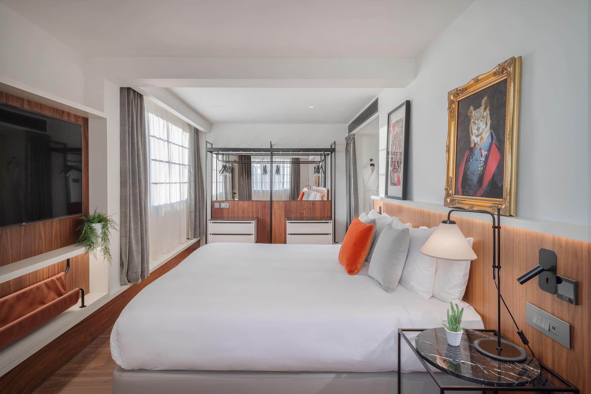 a bedroom with a bed and a mirror