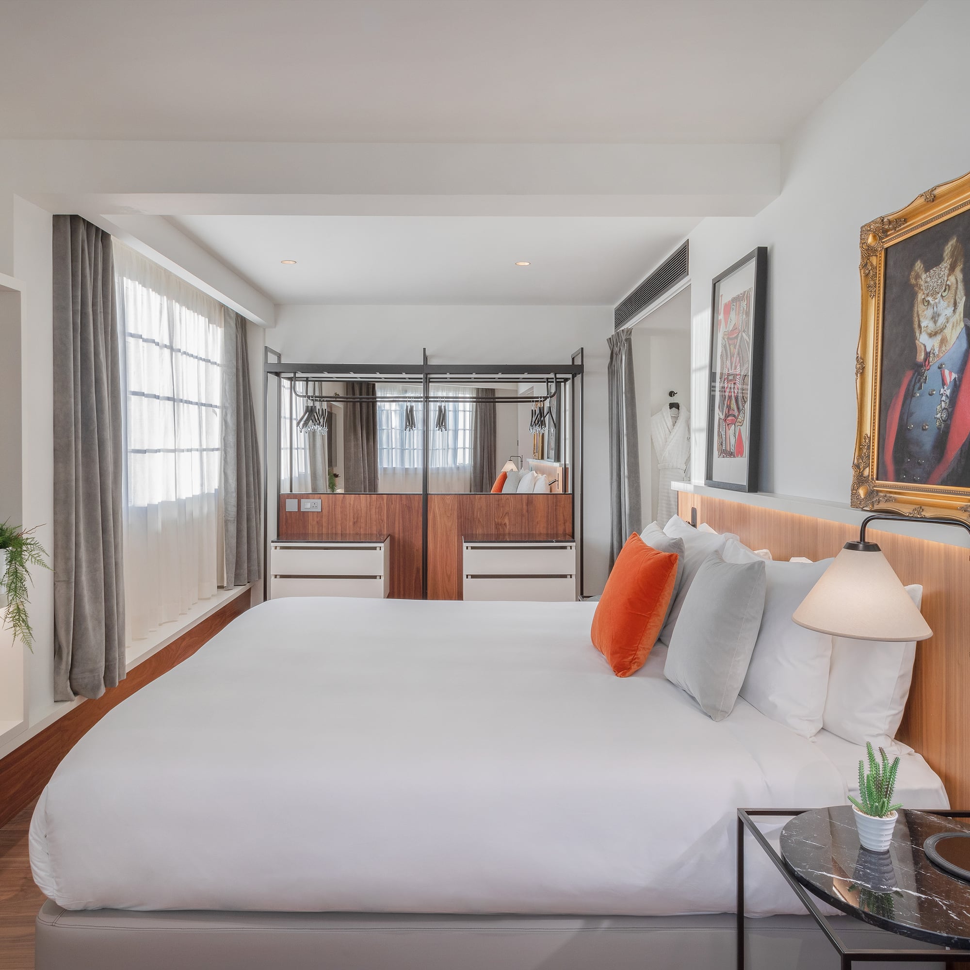 a bedroom with a bed and a mirror