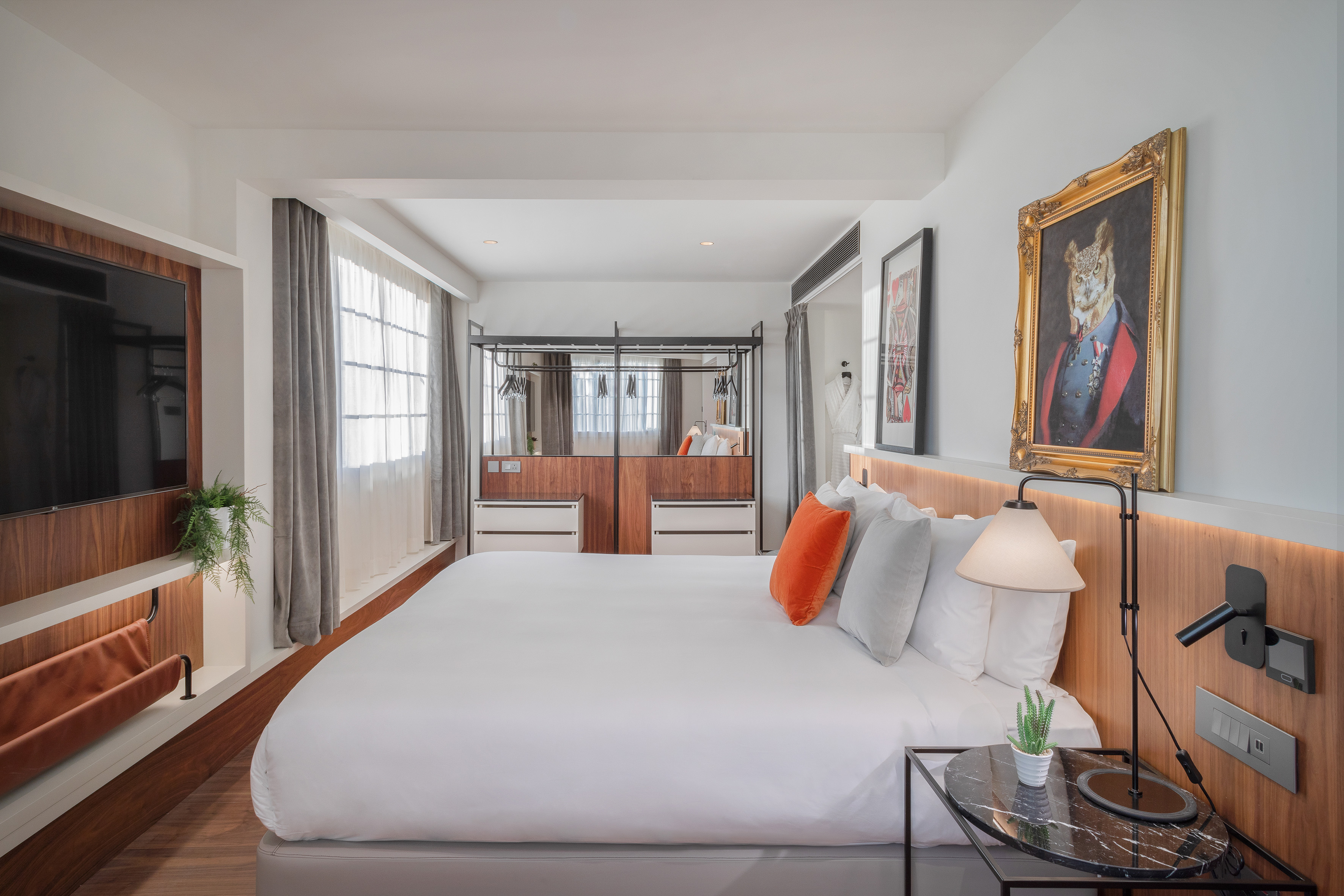 a bedroom with a bed and a mirror