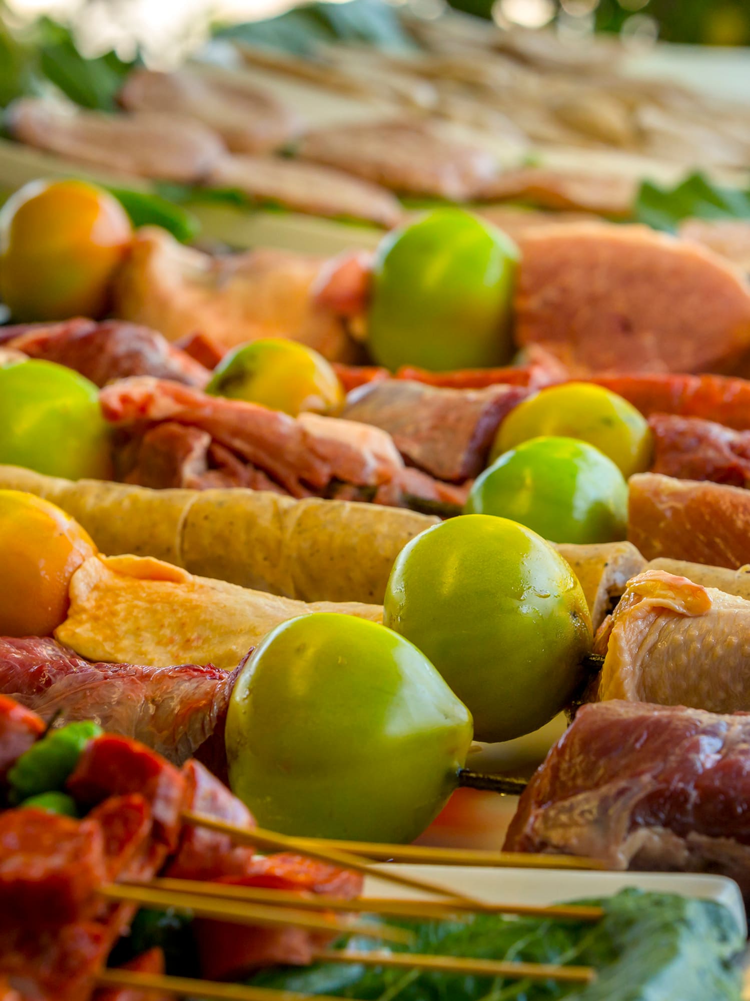 a table with food on skewers