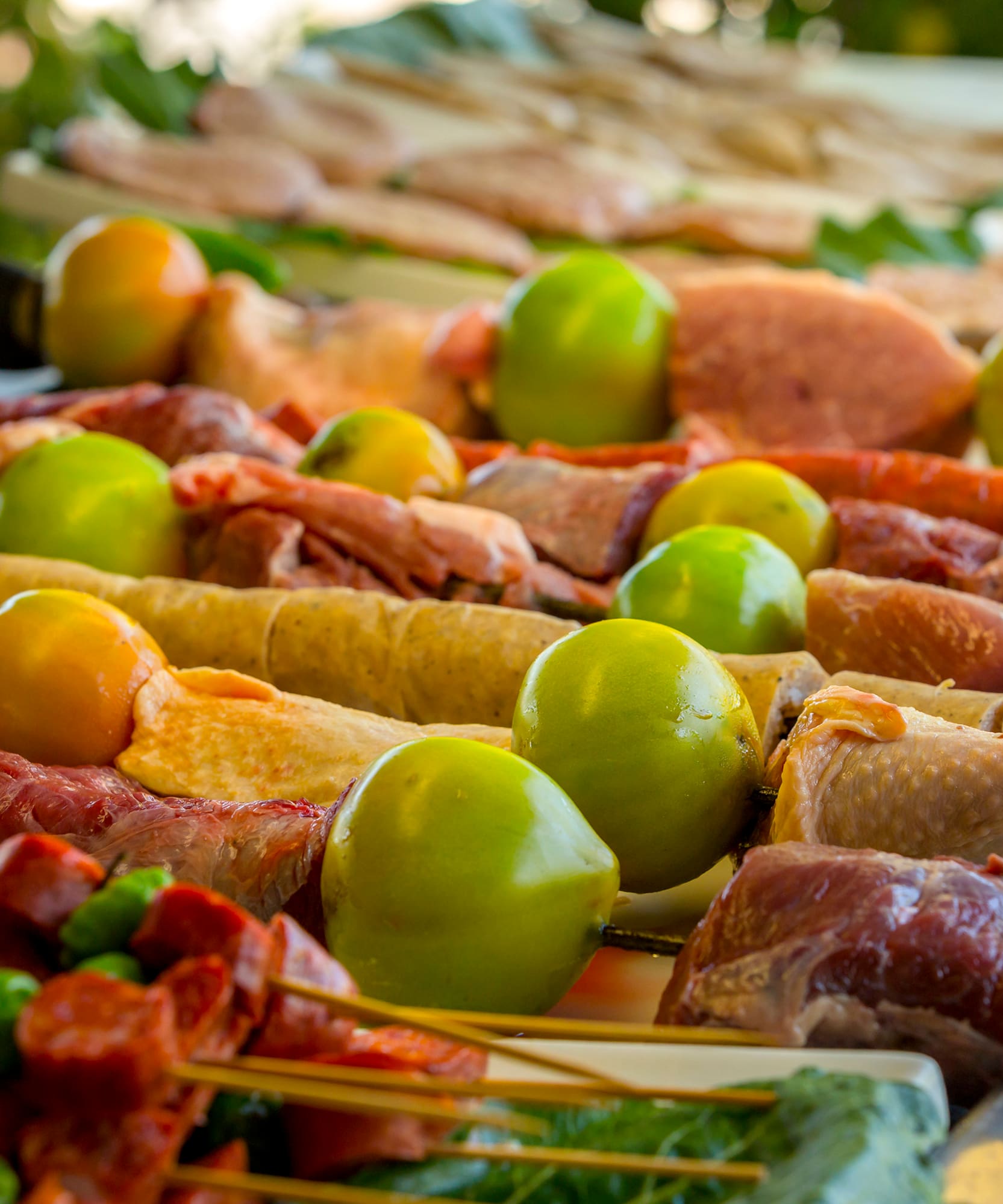 a table with food on skewers