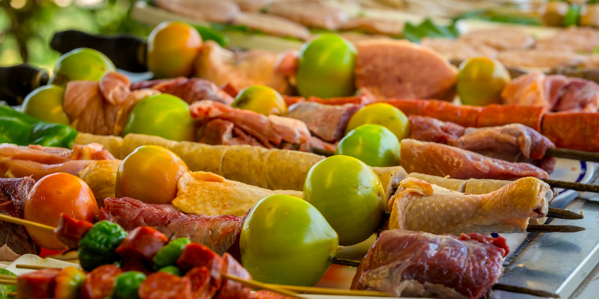 a table with food on skewers