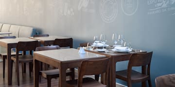 a table with glasses and plates on it