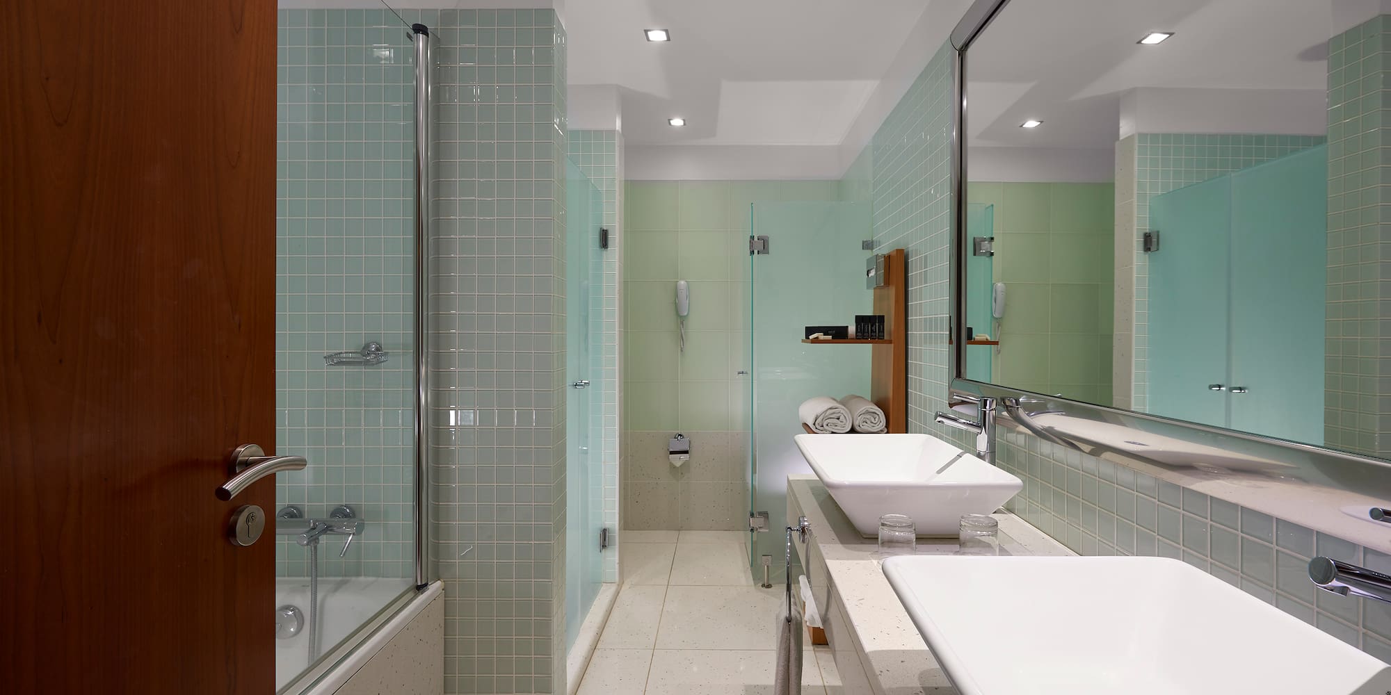 a bathroom with a shower and sink