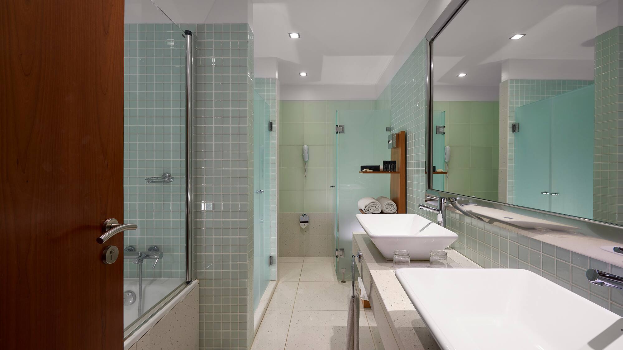 a bathroom with a shower and sink