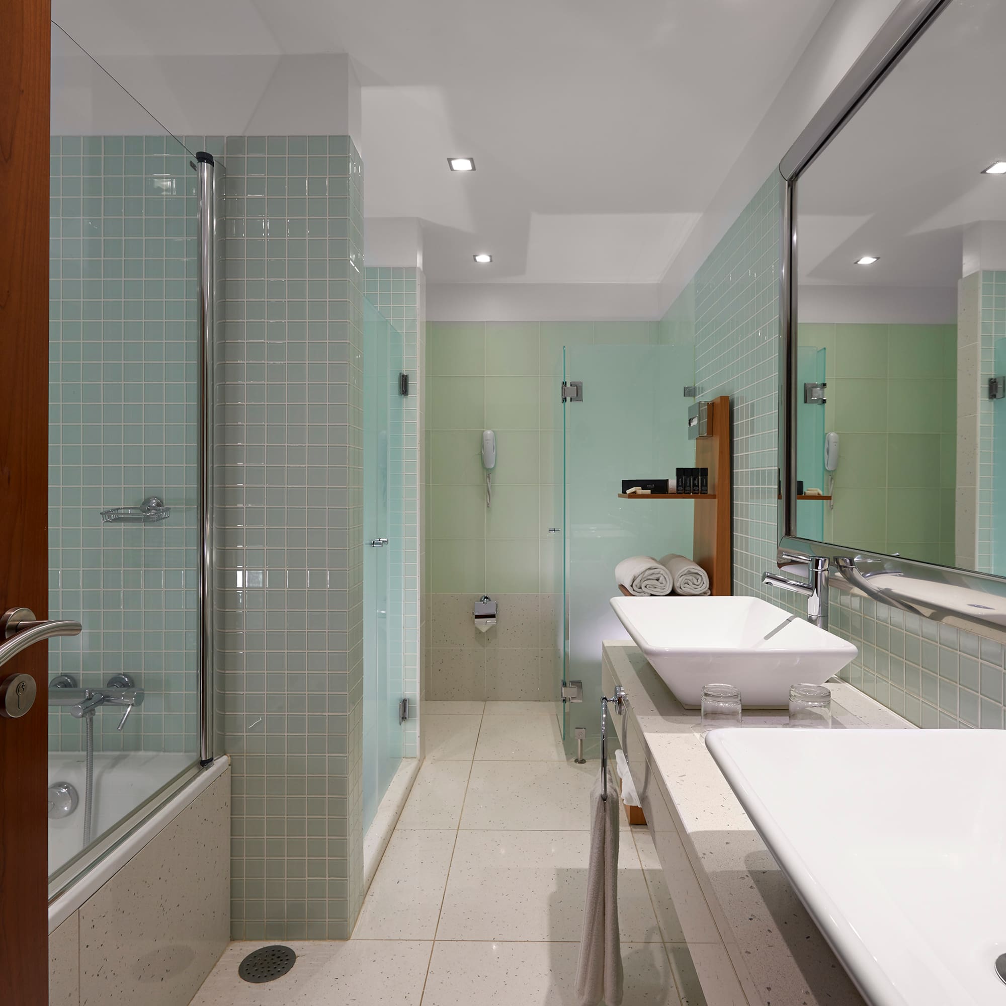 a bathroom with a shower and sink