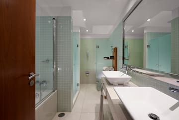 a bathroom with a shower and sink