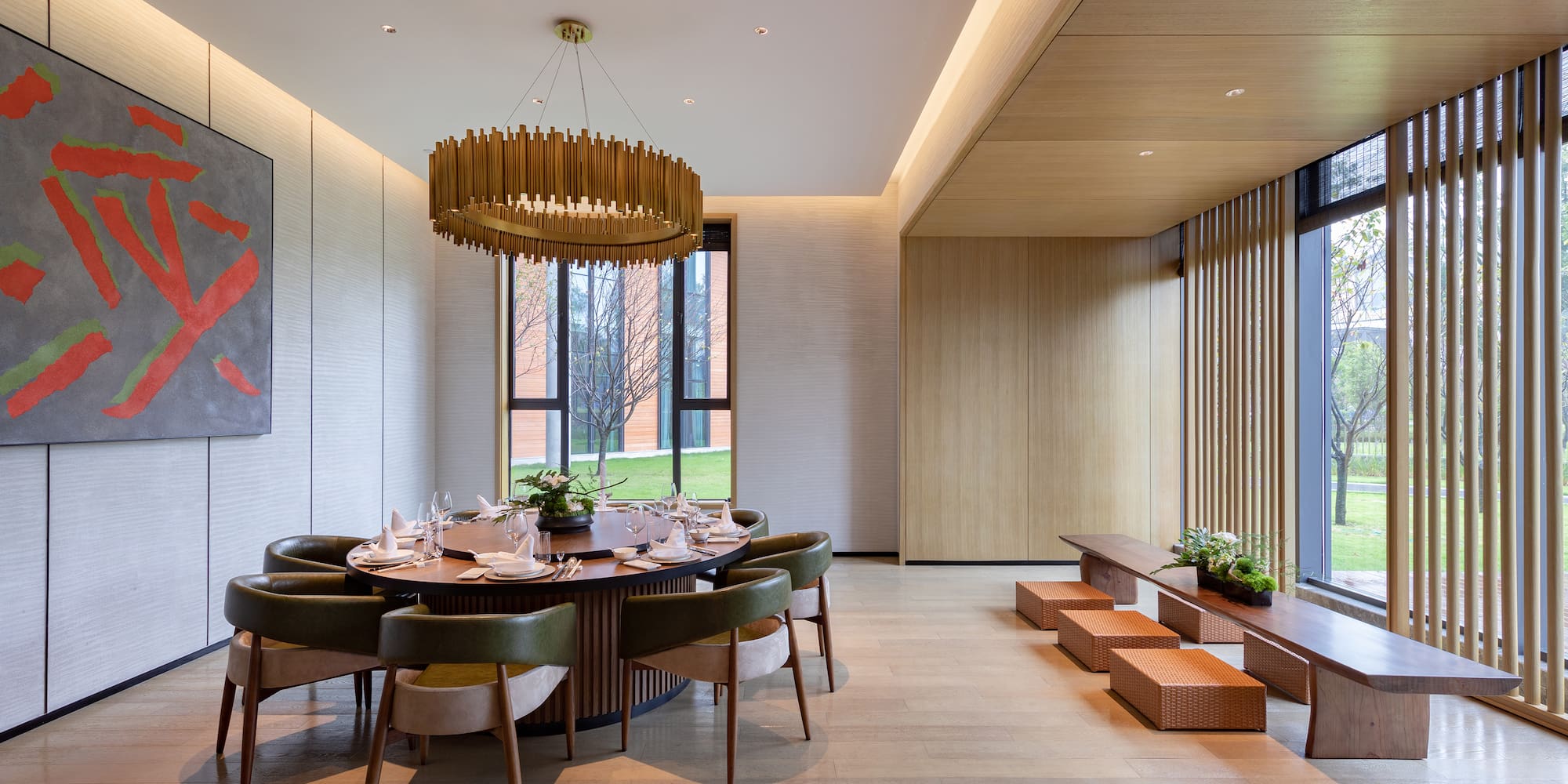 a room with a round table and chairs