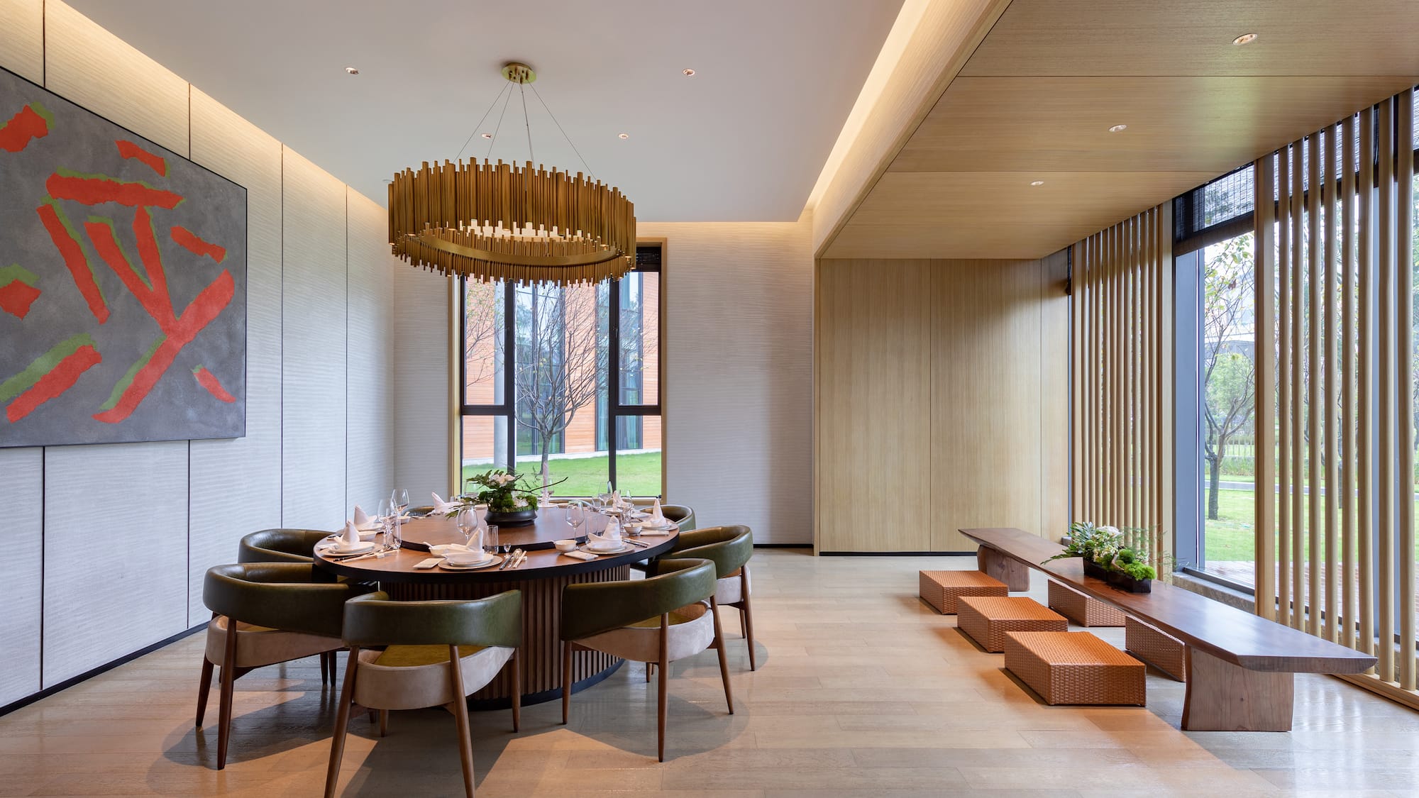 a room with a round table and chairs