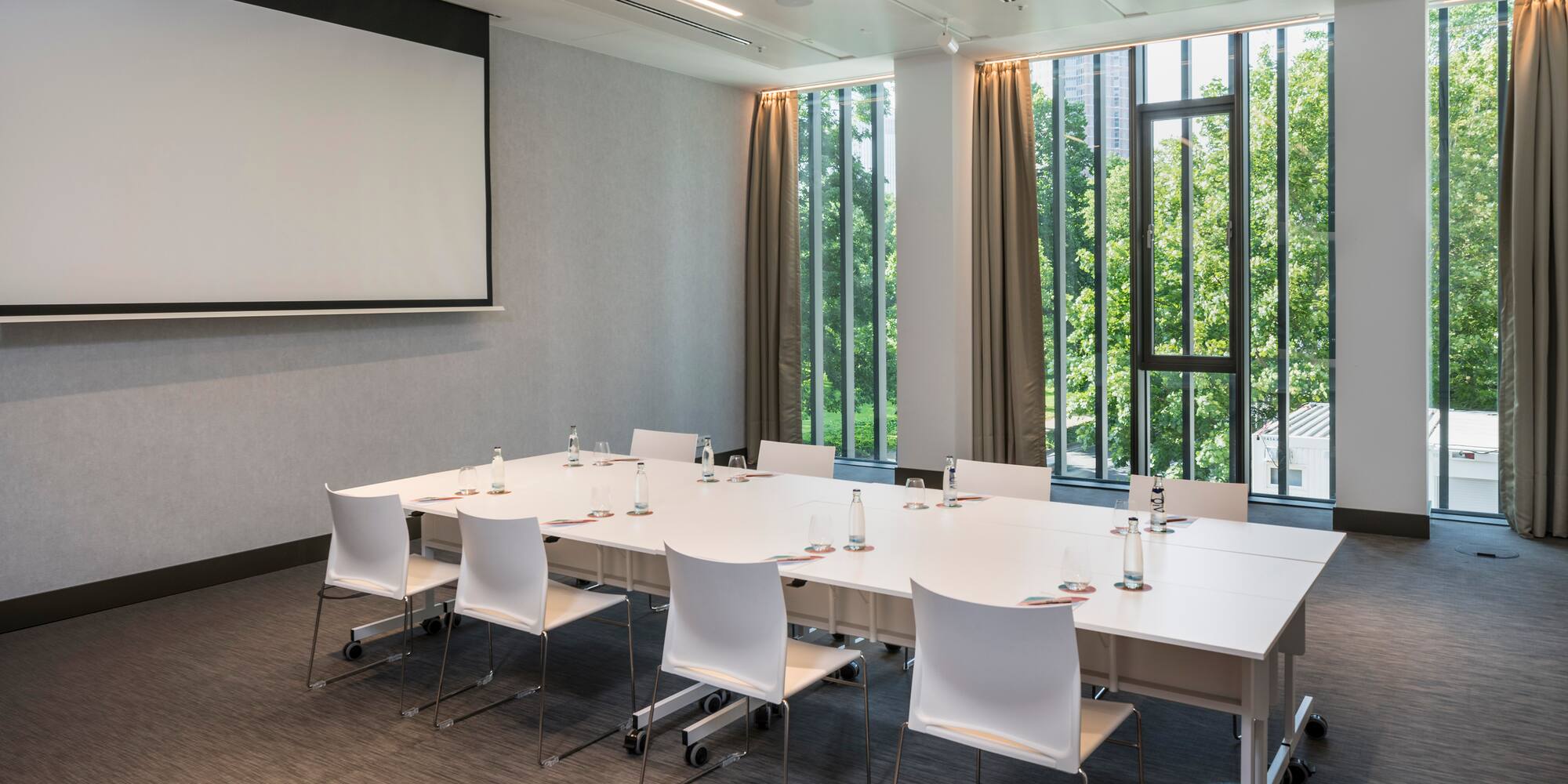 a room with a large table and chairs
