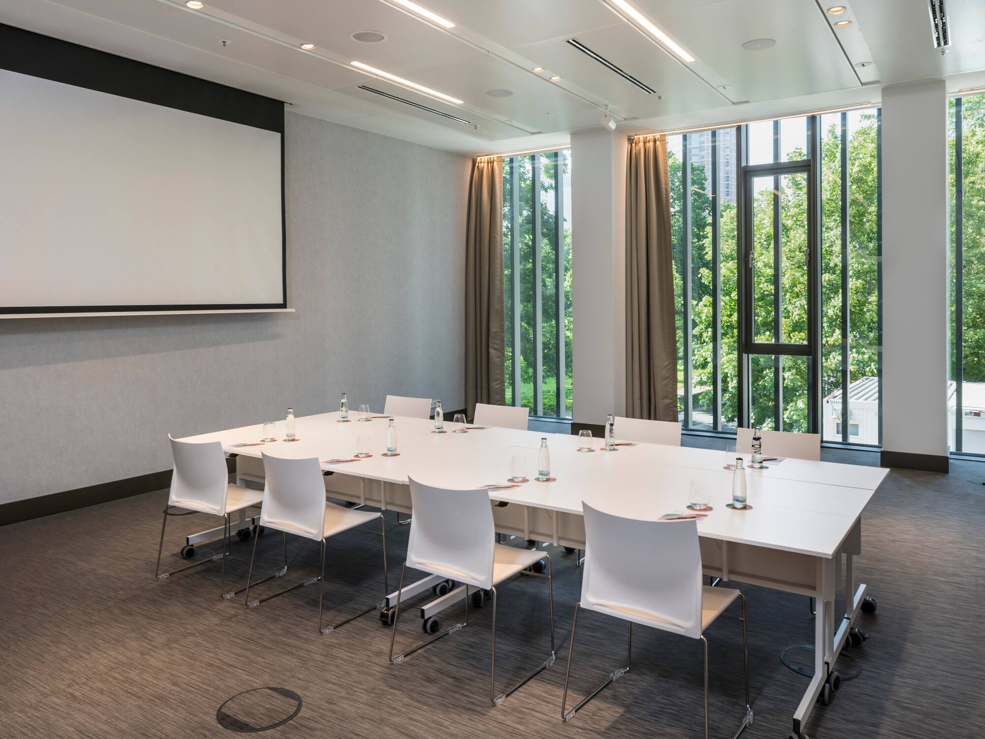 a room with a large table and chairs