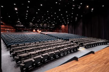 a large auditorium with rows of seats