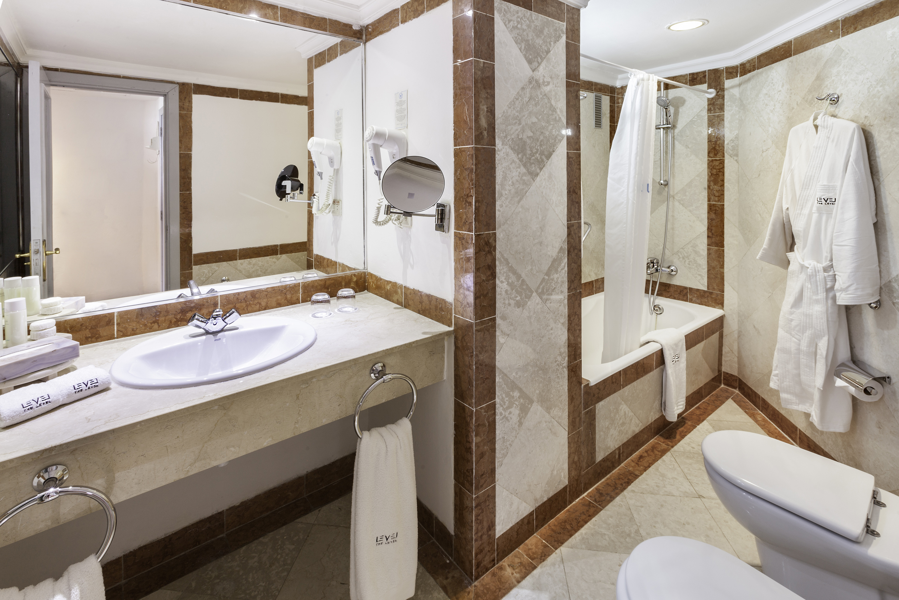 a bathroom with a shower and sink