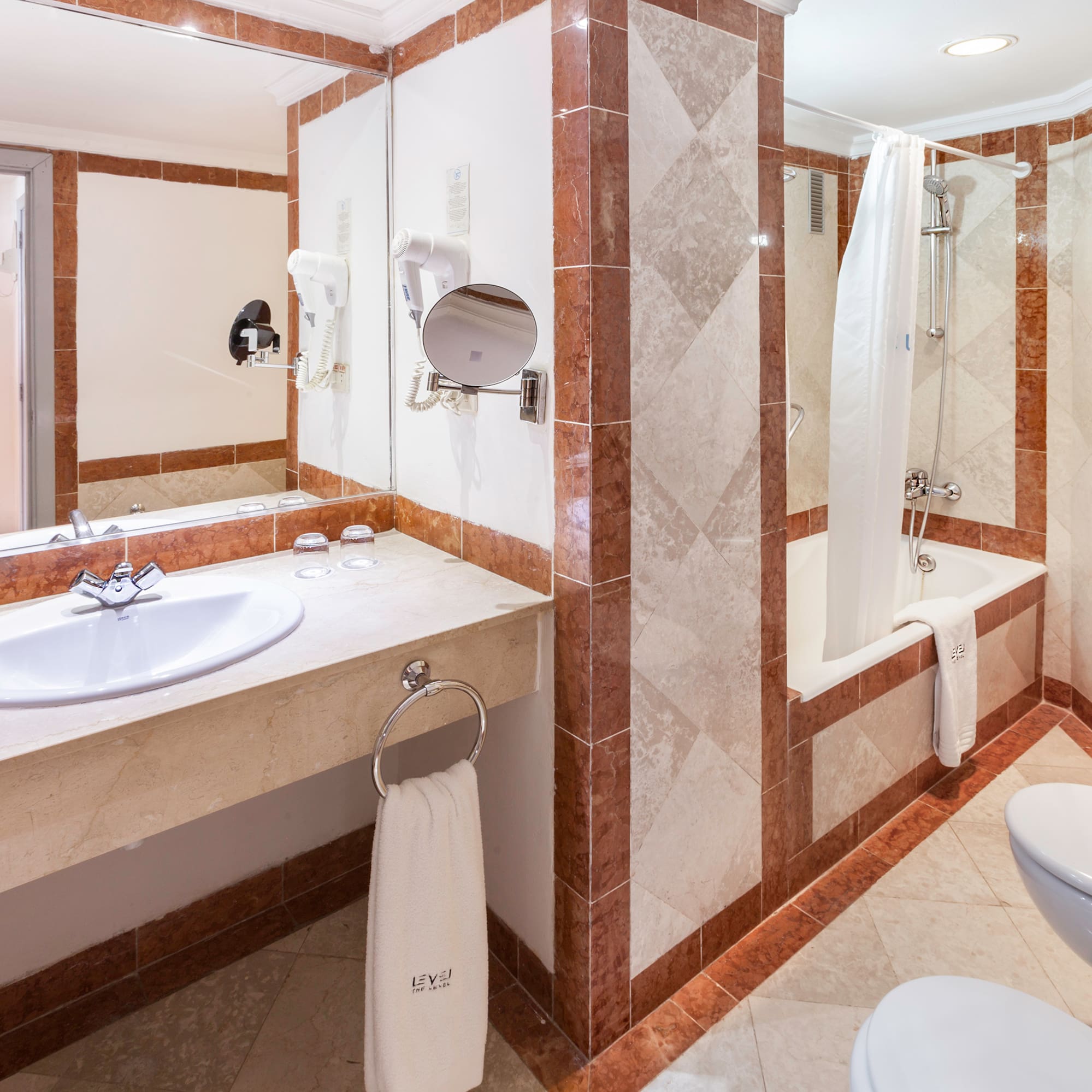 a bathroom with a shower and sink