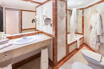 a bathroom with a shower and sink