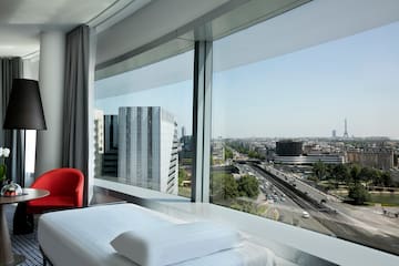 a room with a large window overlooking a city