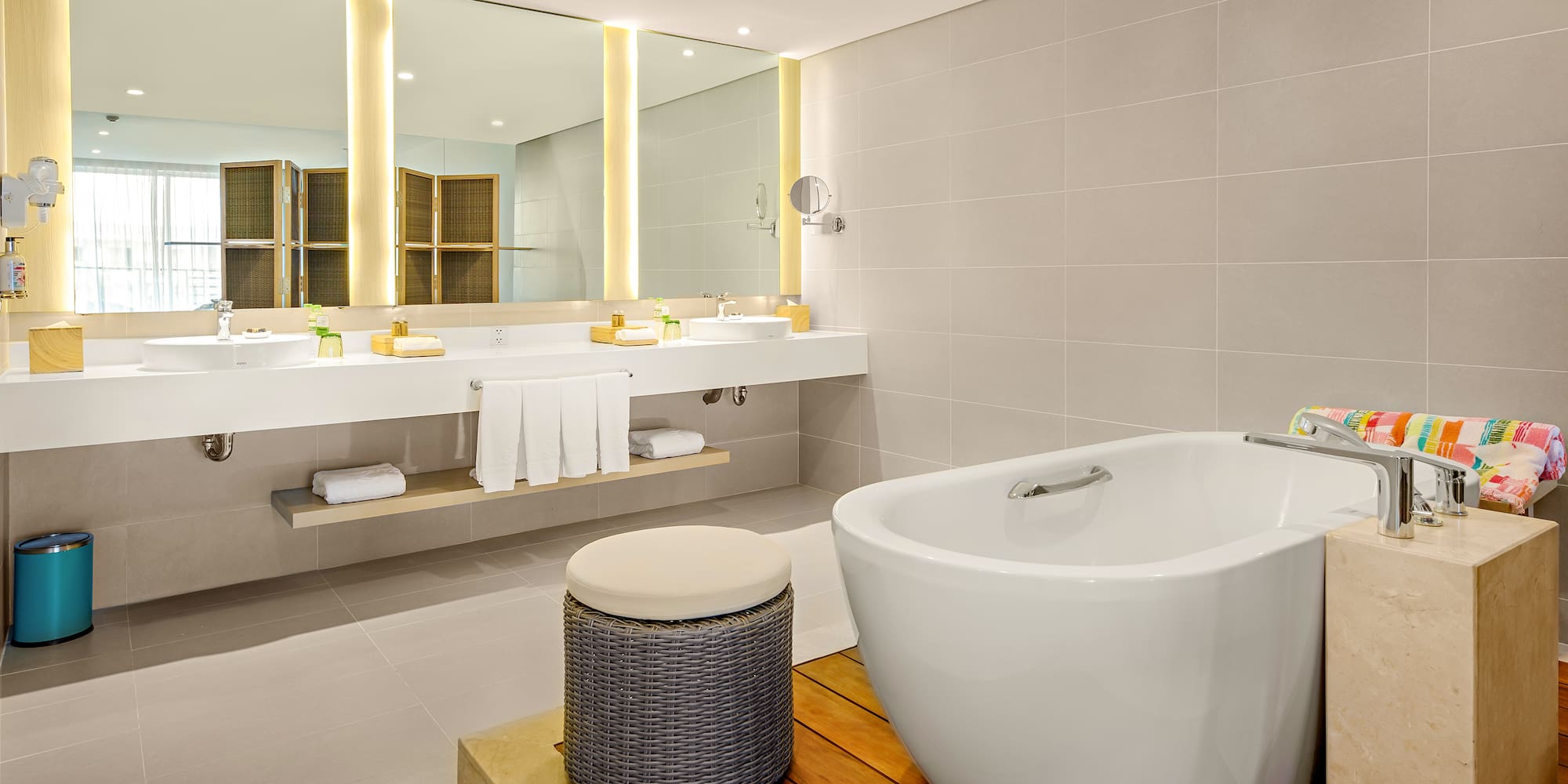 a bathroom with a tub and sinks