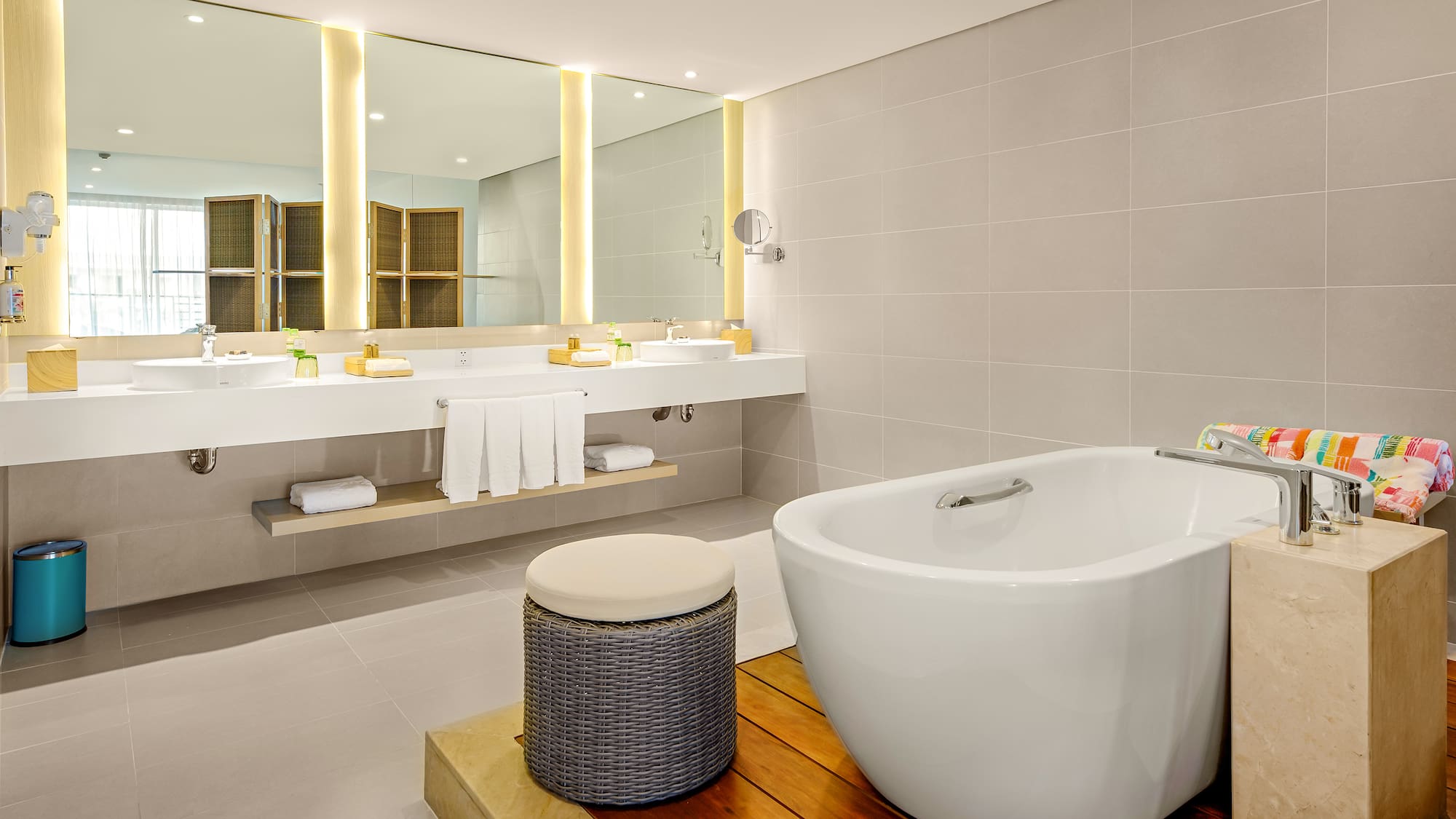 a bathroom with a tub and sinks