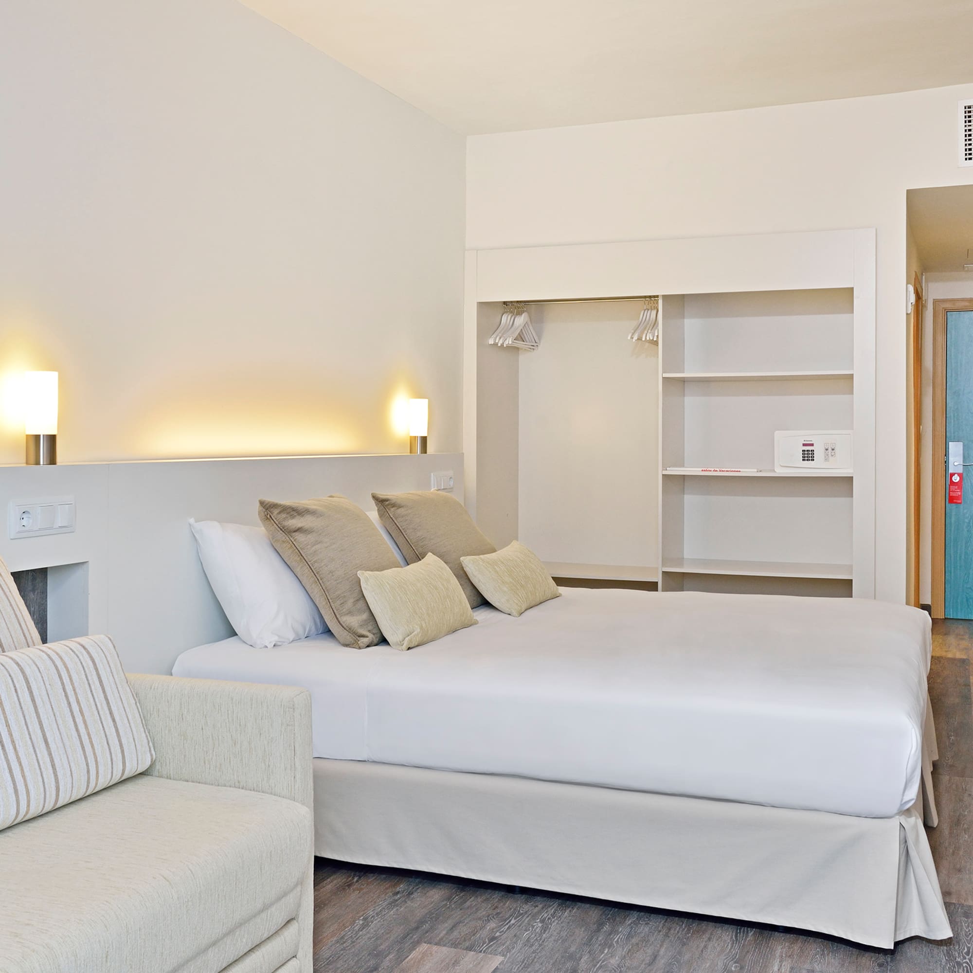 a bedroom with a bed and a couch