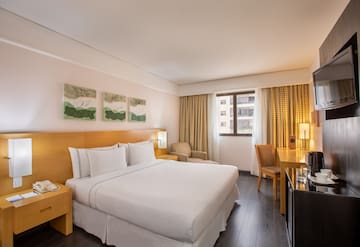 a room with a bed and a desk