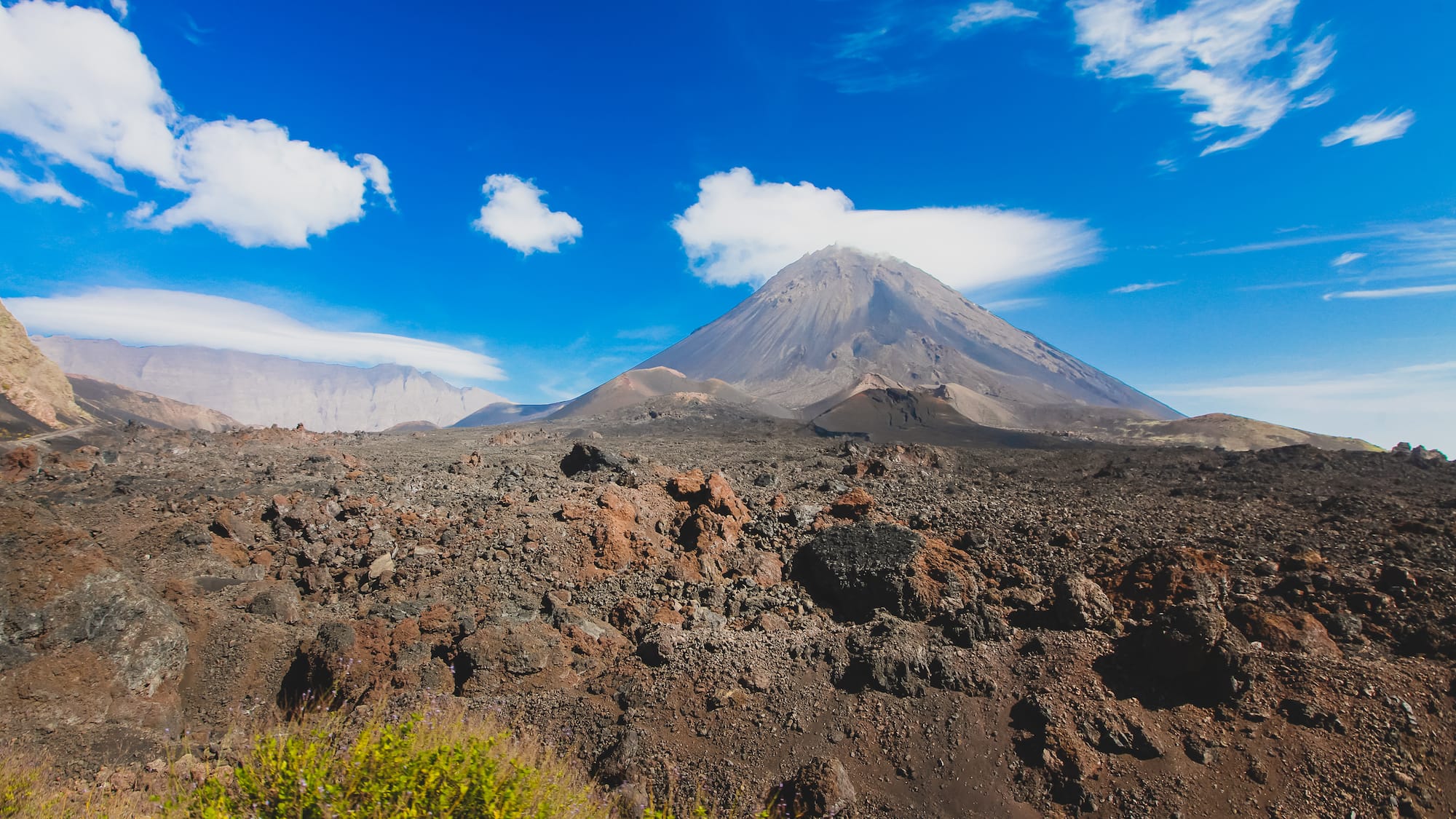 a mountain with a blue sky