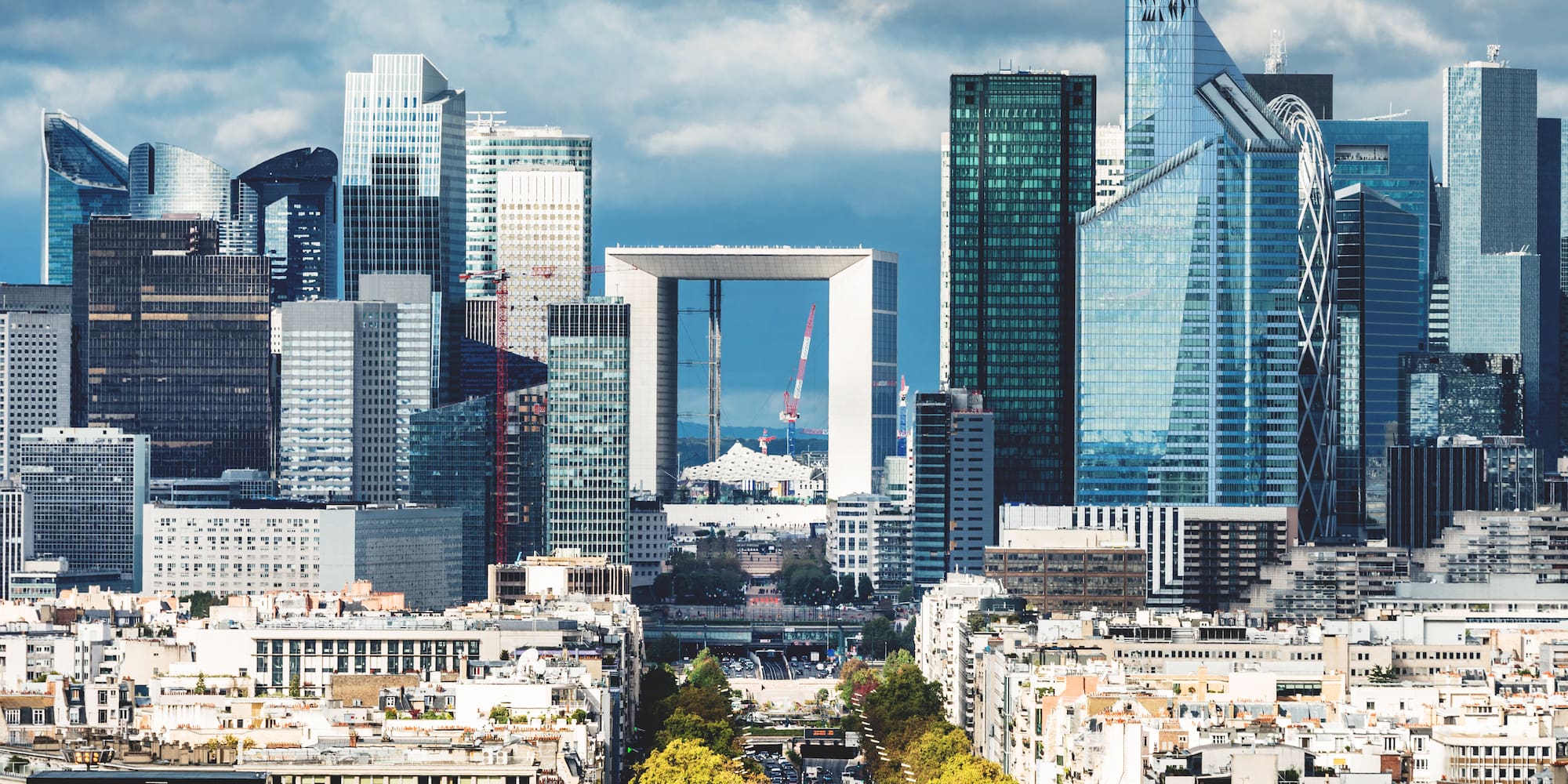a city with a large arch in the middle