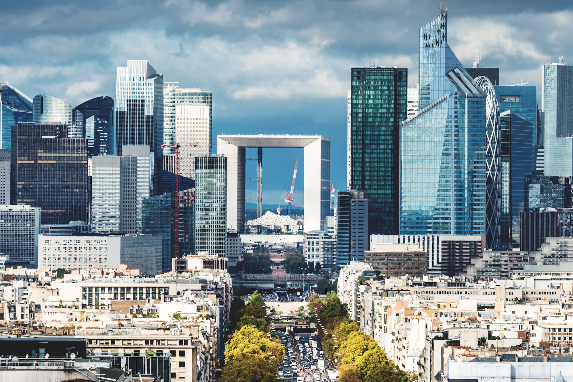 a city with a large arch in the middle