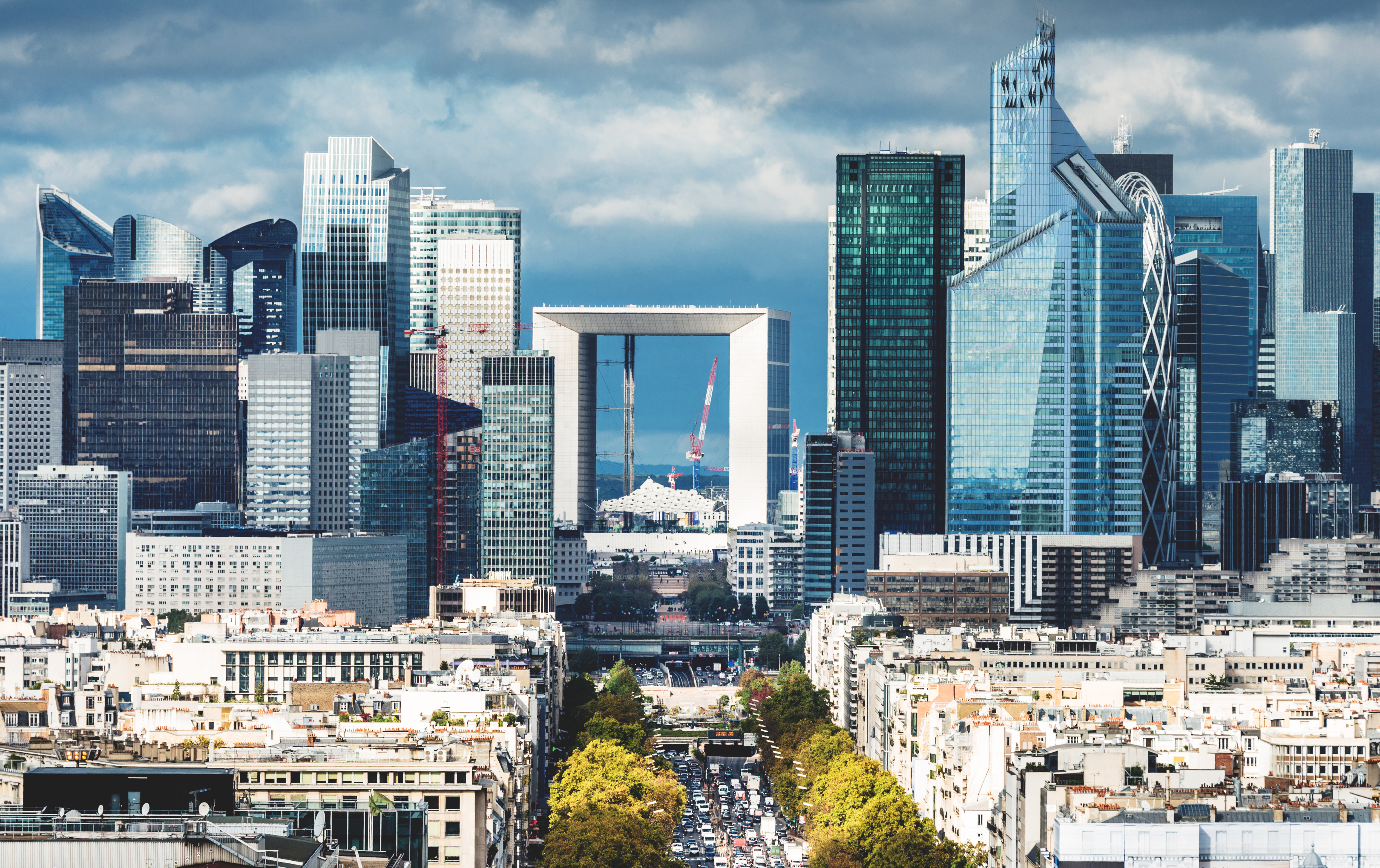 a city with a large arch in the middle