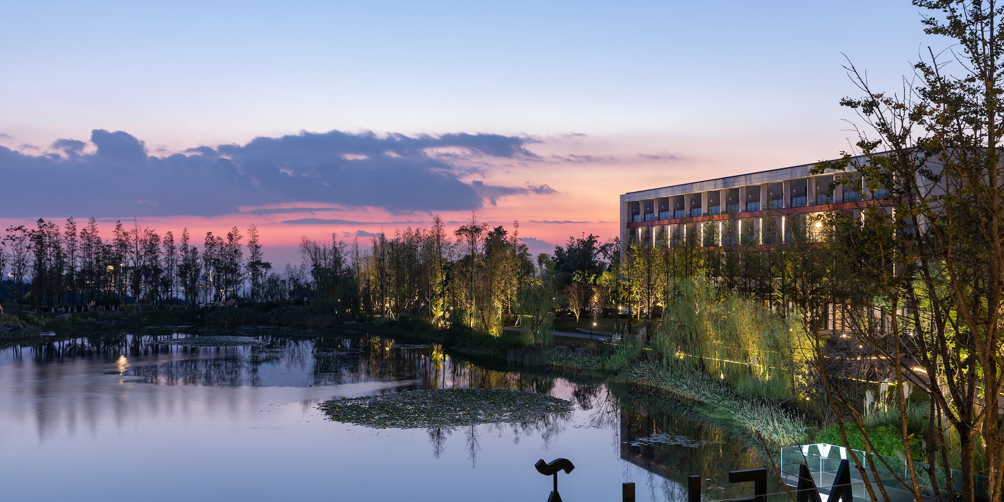 a building next to a body of water